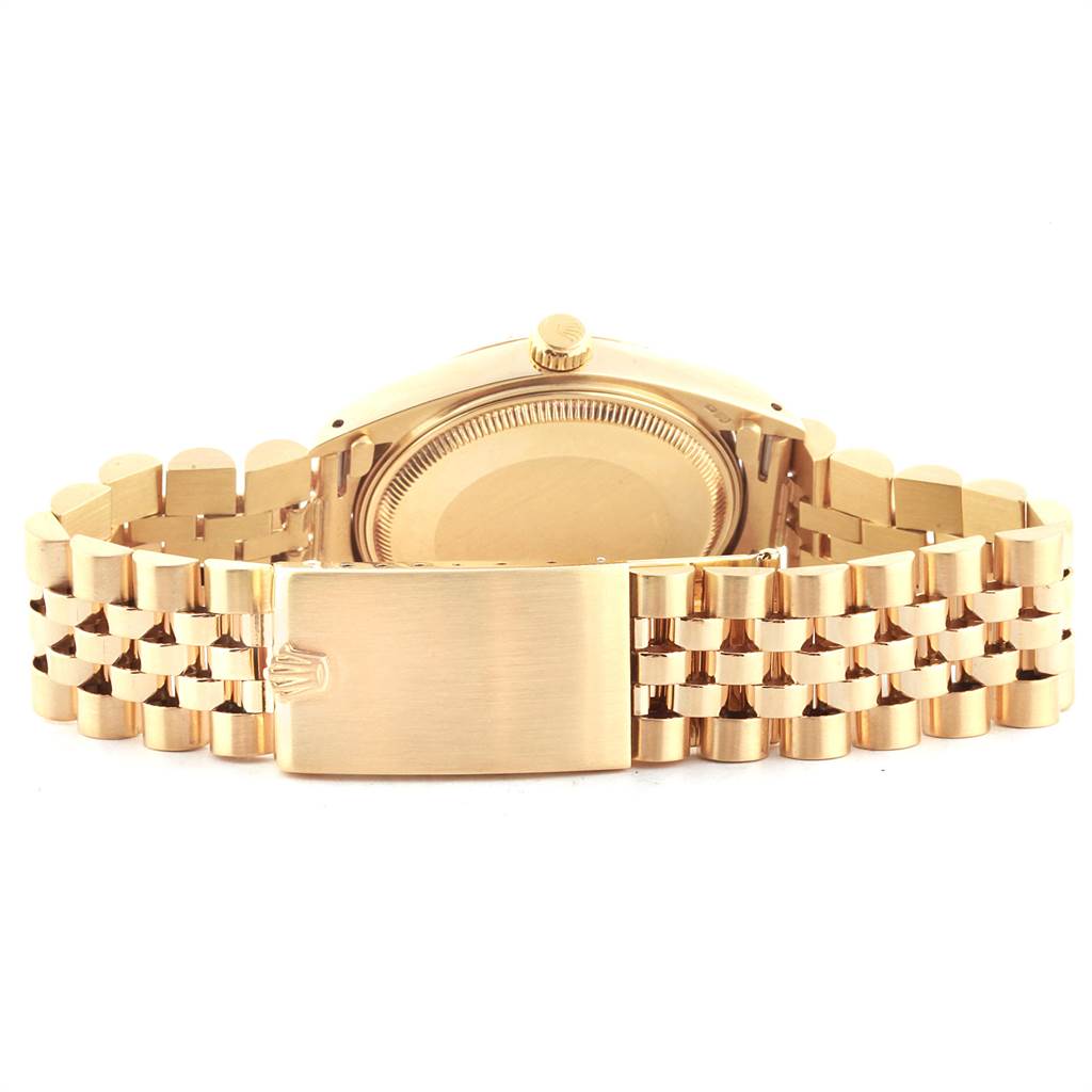 The image shows the back view and clasp of a Rolex Vintage Collection 1503 Men
s Yellow Gold Champagne Dial 1503 Men
s Yellow Gold Champagne Dial watch, highlighting the case back and bracelet.