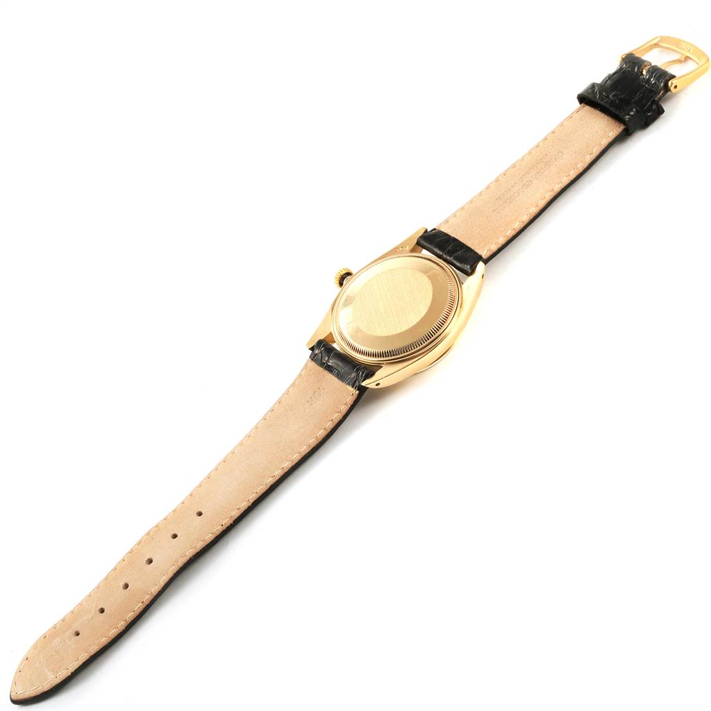 This image shows the back of a Rolex Vintage Collection 1503 Men
s Yellow Gold Champagne Dial 1503 Men
s Yellow Gold Champagne Dial model watch, highlighting the case back, strap, and buckle.