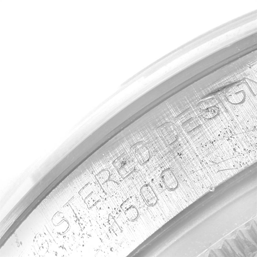 This image shows a close-up of the engraved text on the rim of a Rolex Vintage Collection 1500 Men's Stainless Steel Silver Dial 1500 Men's Stainless Steel Silver Dial watch case.
