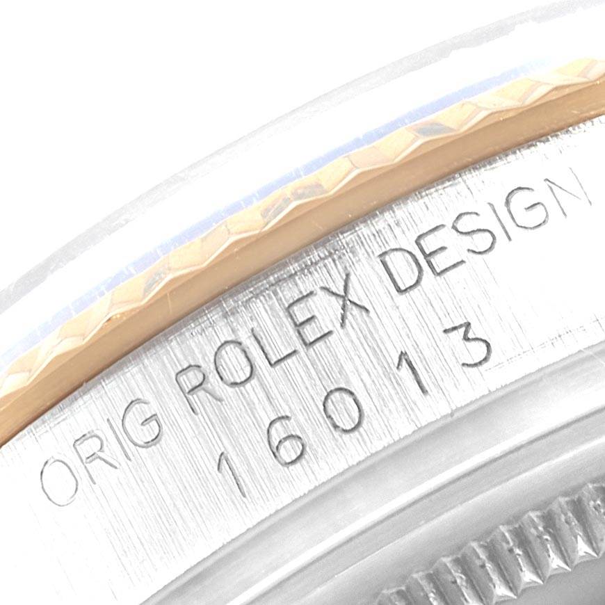 This image shows a close-up of the case edge and engraving of a Vintage Collection Rolex watch, model 16013.