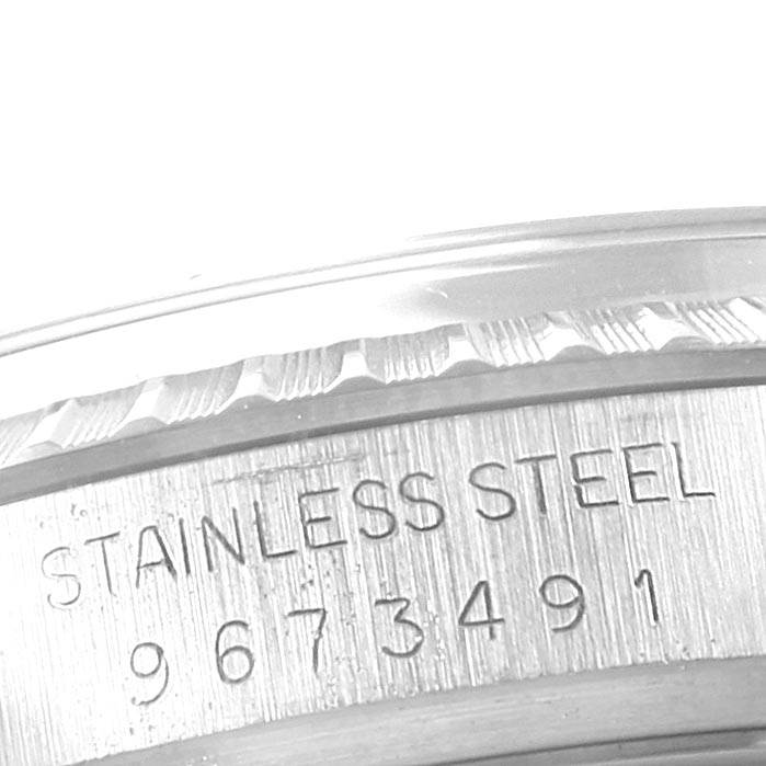 The image shows a close-up of the edge and case back of the Rolex Vintage Collection 16030 Men's Stainless Steel Grey Dial 16030 Men's Stainless Steel Grey Dial watch, highlighting the stainless steel material and serial number.