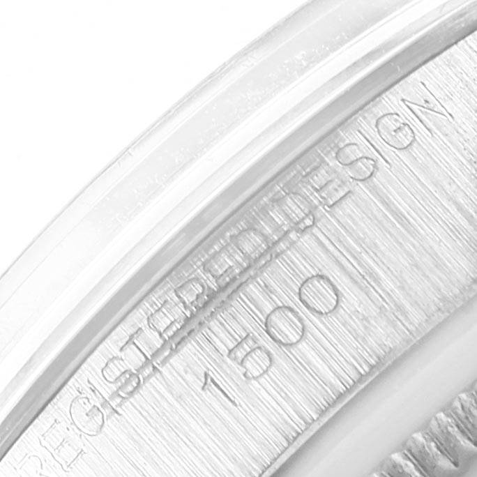 The image shows a close-up of the engraved bezel of a Rolex Vintage Collection 1500 Men's Stainless Steel Blue Dial 1500 Men's Stainless Steel Blue Dial model, displaying part of the "REGISTERED DESIGN" text and the number "1500".