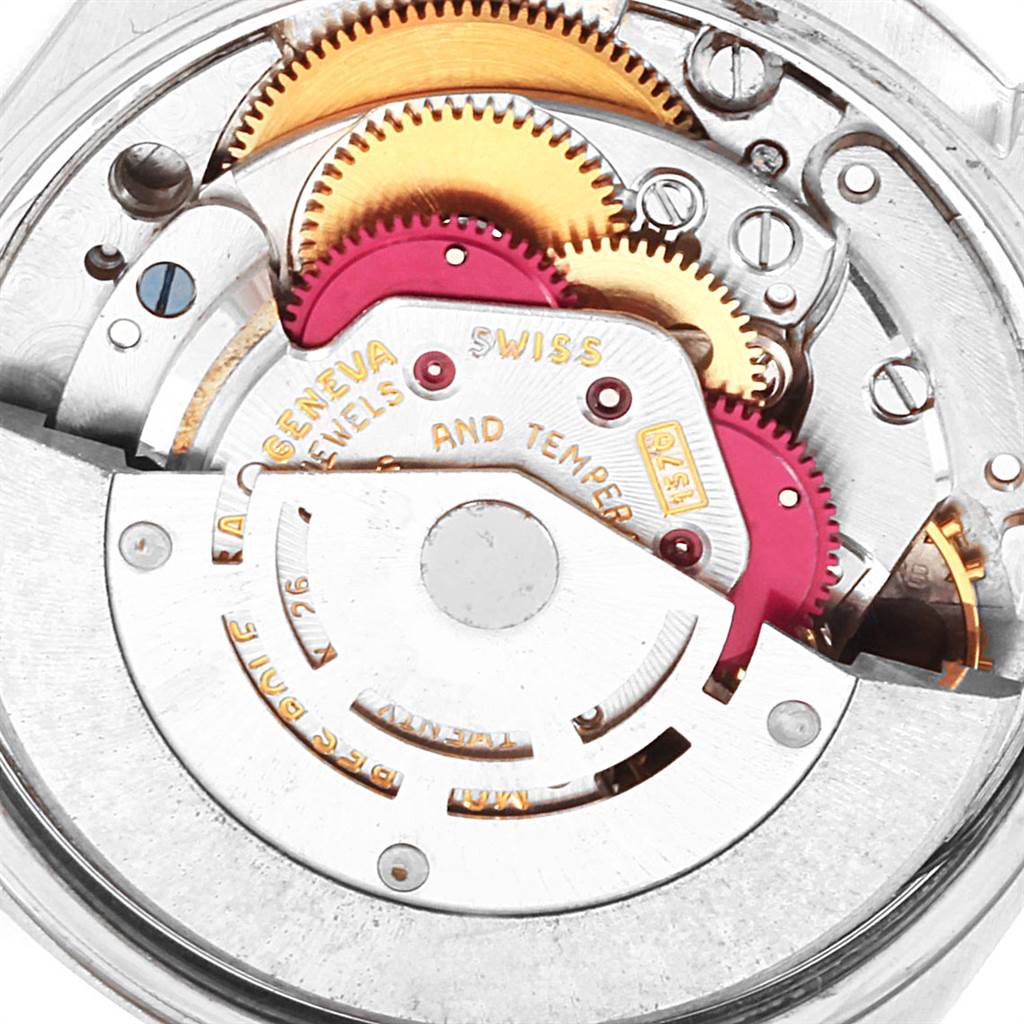 The image shows the intricate internal mechanism of a Rolex Vintage Collection 1500 Men's Stainless Steel Blue Dial 1500 Men's Stainless Steel Blue Dial watch, featuring gears and components.