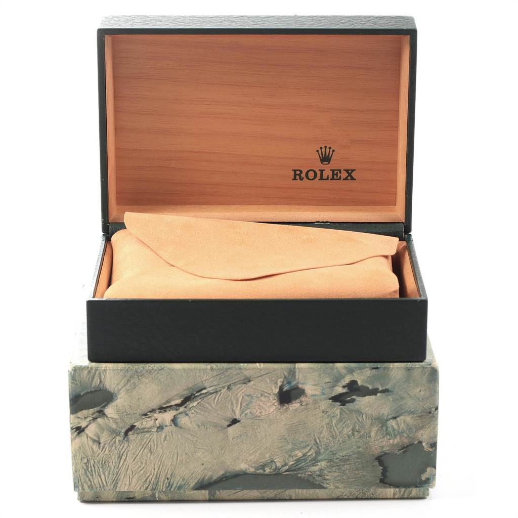 This image shows an open Rolex watch box for the Vintage Collection model, with an interior cushion and cover visible.