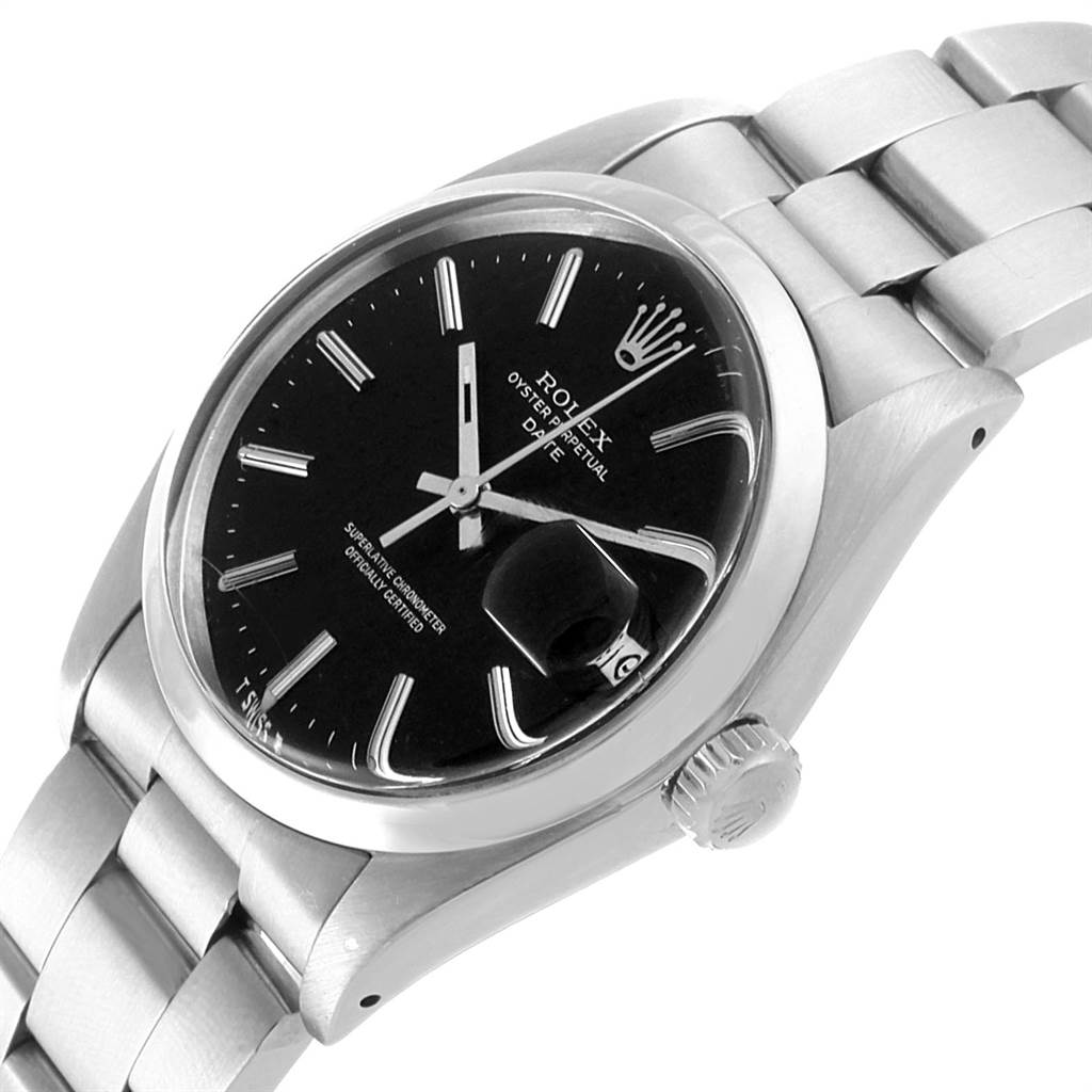 The Vintage Collection Rolex watch is shown at a slight angle, highlighting its black dial, bracelet, crown, and date magnifier.