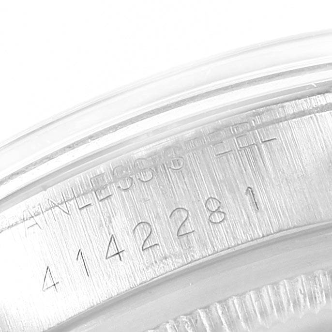 This image shows a close-up of the serial number engraving on the stainless steel case back of a Rolex Vintage Collection 1500 Men's Stainless Steel Black Dial 1500 Men's Stainless Steel Black Dial watch.