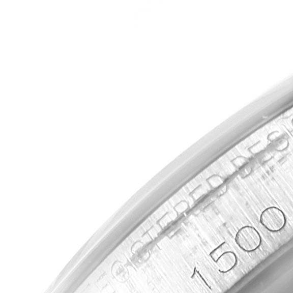 This is a close-up image showing the inner bezel of a Rolex Vintage Collection 1500 Men's Stainless Steel White Dial 1500 Men's Stainless Steel White Dial model watch with part of the serial number visible.