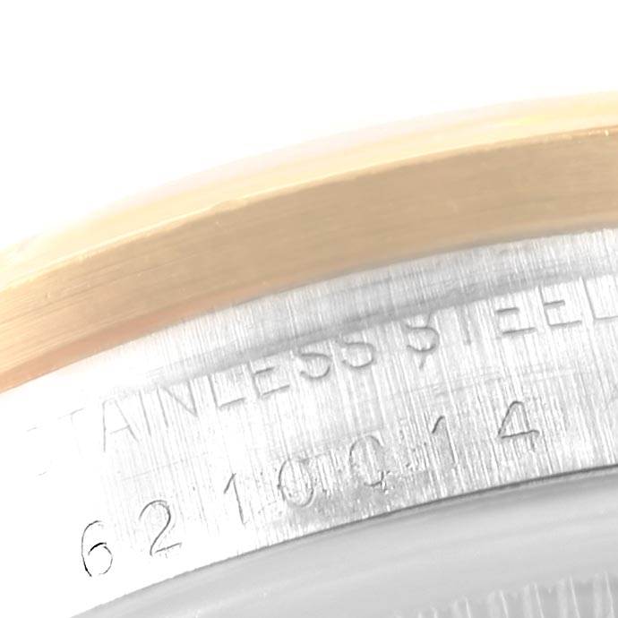This close-up image shows the case edge and part of the engravings on the Rolex Vintage Collection 1500 Men's Steel and Gold (two tone) Champagne Dial 1500 Men's Steel and Gold (two tone) Champagne Dial watch.