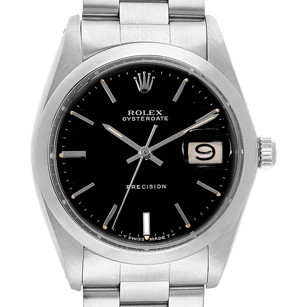 The Vintage Collection Rolex watch is shown from a front angle, highlighting its black dial, date window, and stainless steel bracelet.