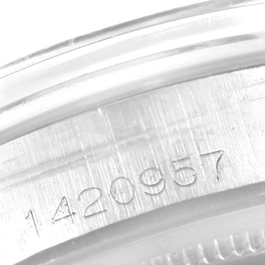 This image shows a close-up of the serial number engraved on the side of a Rolex Vintage Collection 6694 Men's Stainless Steel Black Dial 6694 Men's Stainless Steel Black Dial watch case.