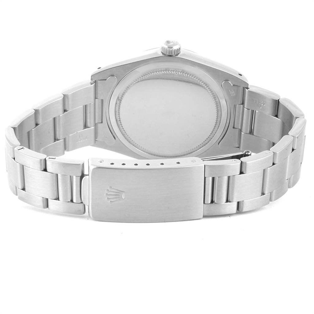 The image shows the back view of a Rolex Vintage Collection 6694 Men's Stainless Steel Black Dial 6694 Men's Stainless Steel Black Dial watch, focusing on the case back and the bracelet clasp.