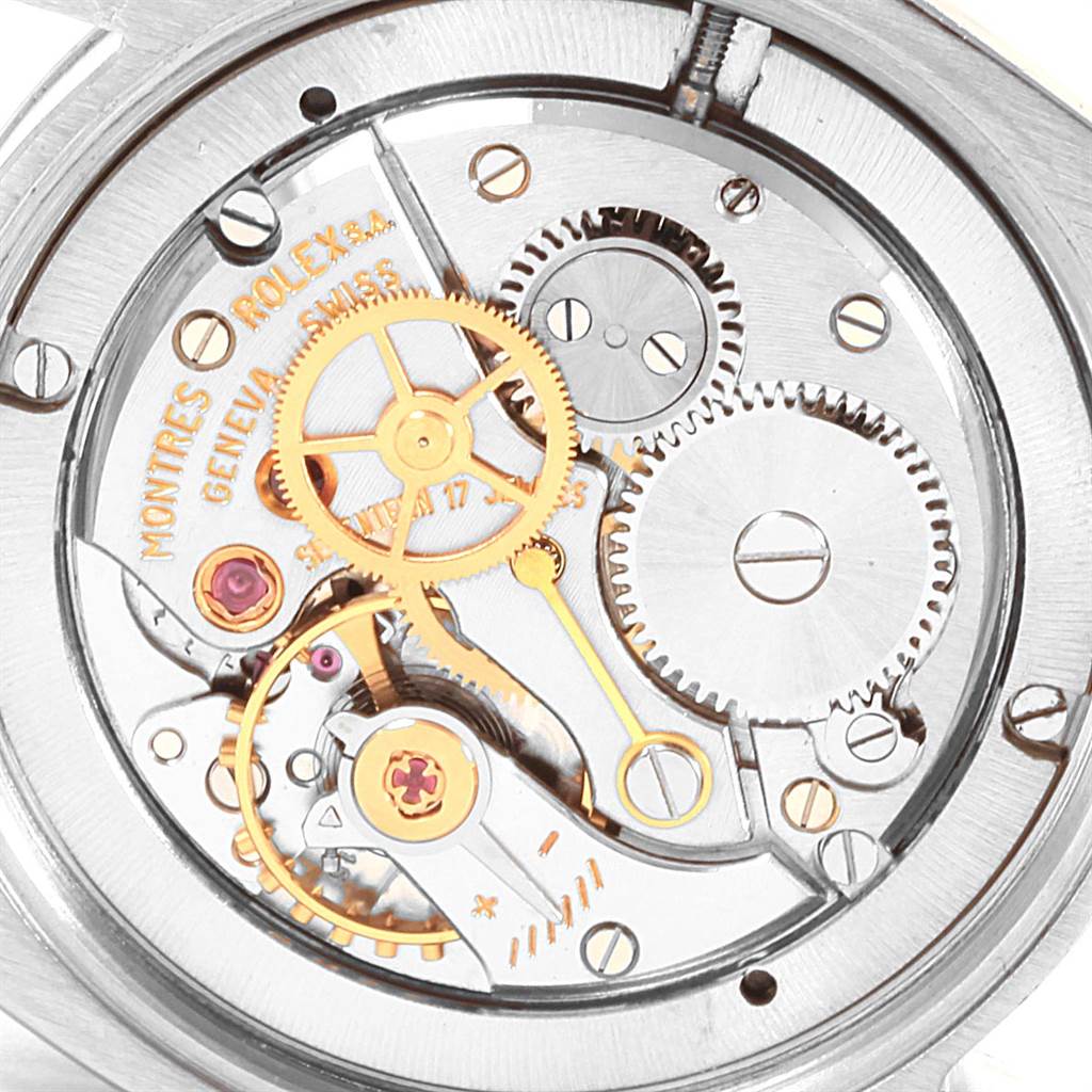 This image shows the intricate inner mechanism of the Rolex Vintage Collection 6694 Men's Stainless Steel Black Dial 6694 Men's Stainless Steel Black Dial watch, highlighting gears and components from a close-up angle.