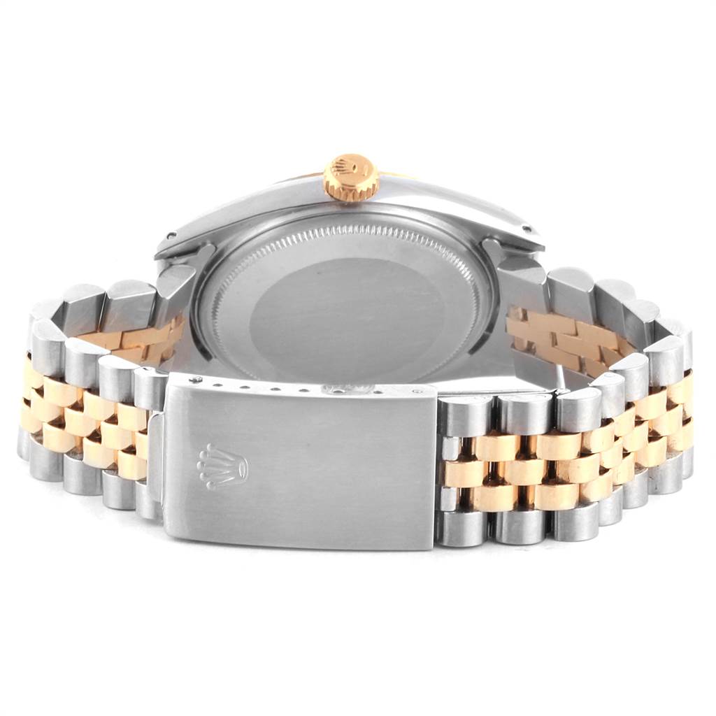 The image shows the back view of the Vintage Collection model by Rolex, highlighting the case back, crown, and two-tone bracelet.