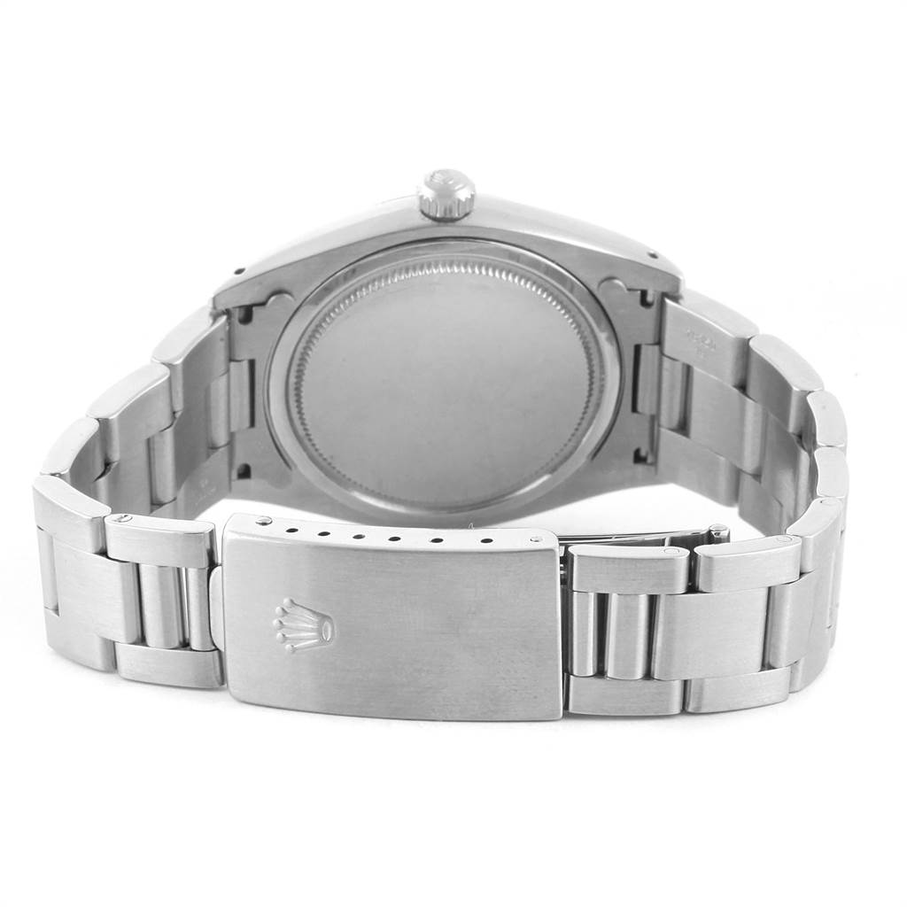 The image shows the back view of the Rolex Vintage Collection 6694 Men's Stainless Steel Silver Dial 6694 Men's Stainless Steel Silver Dial model watch, highlighting the case, crown, and metal bracelet with clasp.