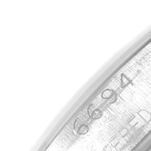 This image shows a close-up of the inner casing with engravings of the Rolex Vintage Collection 6694 Men's Stainless Steel Silver Dial 6694 Men's Stainless Steel Silver Dial watch.
