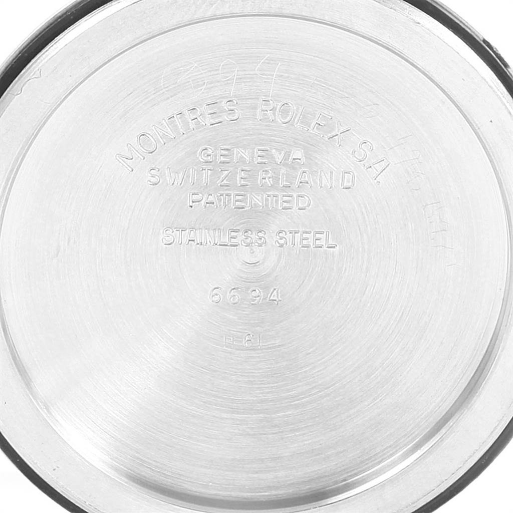 The image shows the back case of a Rolex Vintage Collection 6694 Men's Stainless Steel Silver Dial 6694 Men's Stainless Steel Silver Dial watch, displaying engravings and specifications.
