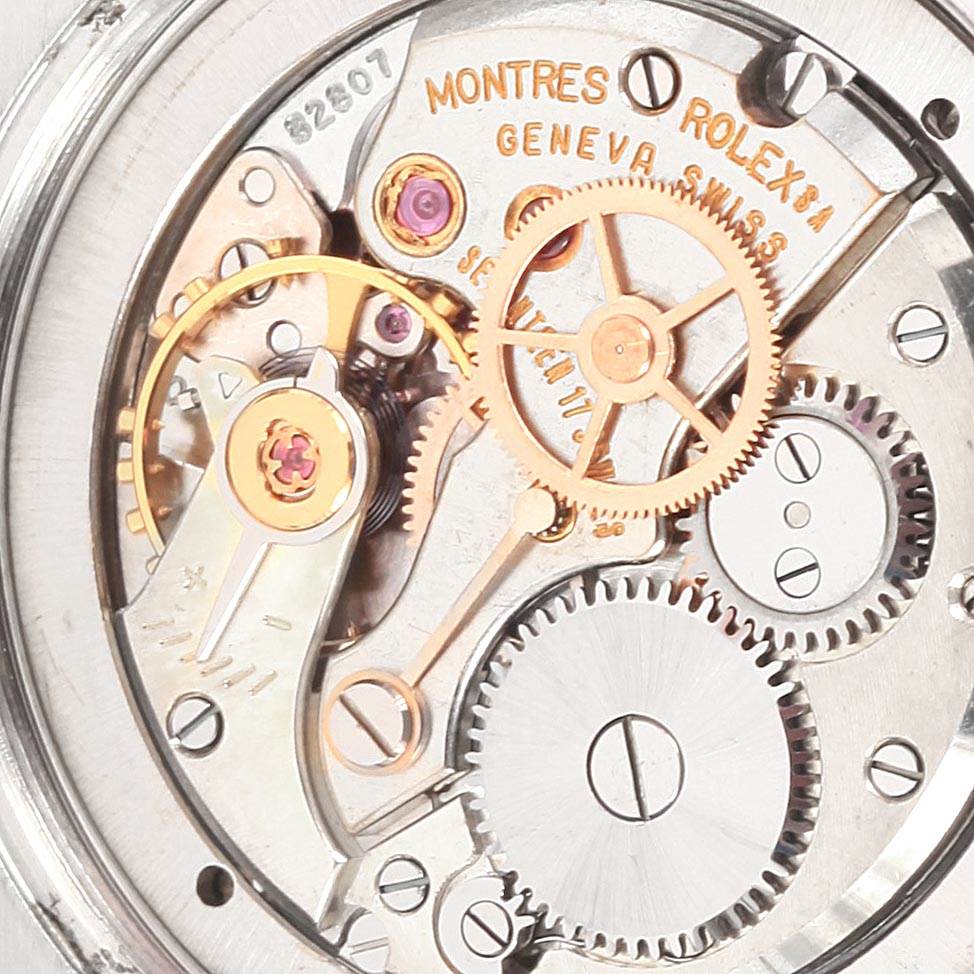 The image shows the inner mechanism and movement parts of a Vintage Collection Rolex watch.