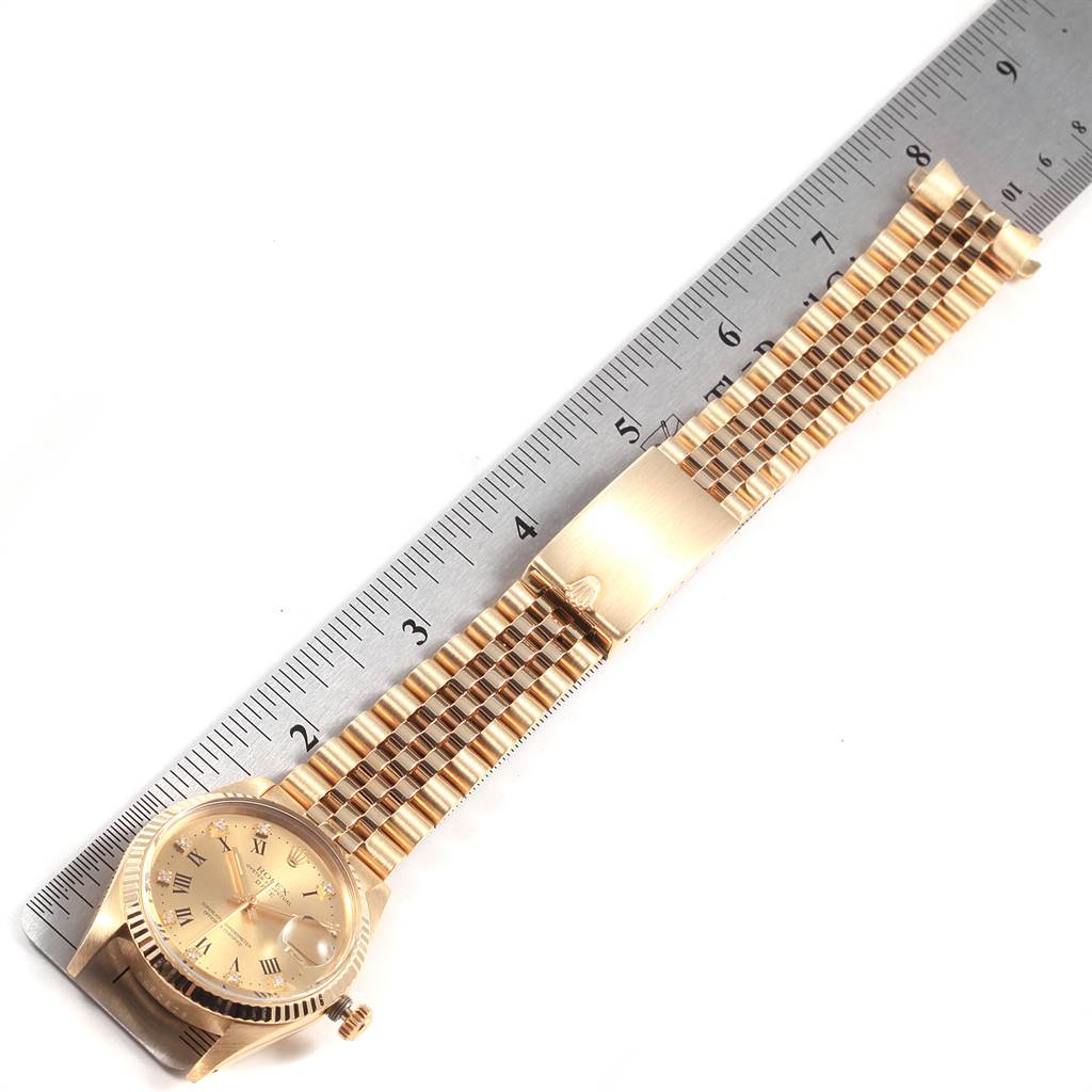 This image shows a Rolex Vintage Collection 15037 Men's Yellow Gold Champagne Dial 15037 Men's Yellow Gold Champagne Dial watch face and band, placed alongside a ruler for scale, viewed from above.