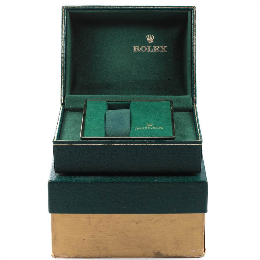 The image shows the open box of a Vintage Collection model by Rolex, displaying its brand logo inside.