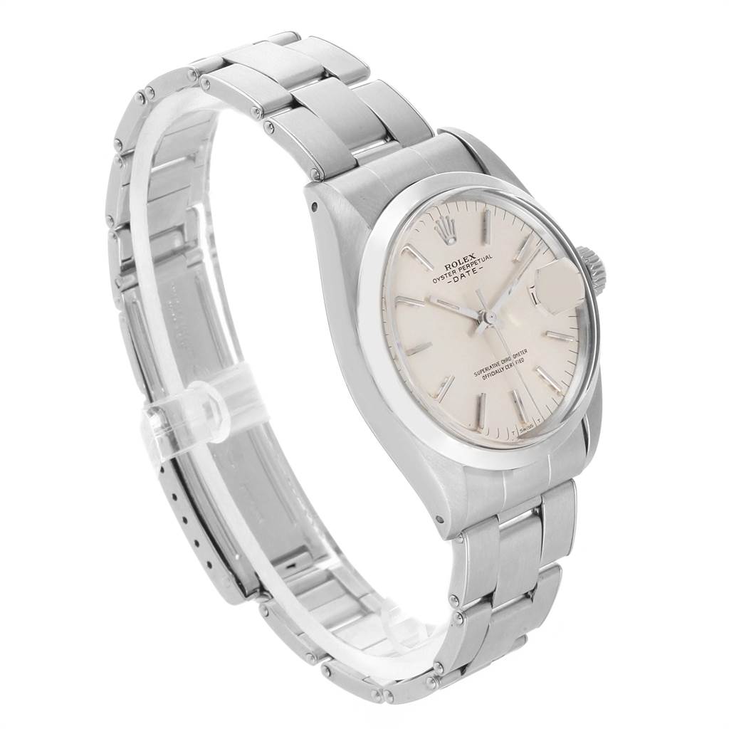 The Vintage Collection Rolex watch is shown at an angle highlighting its dial, case, crown, and stainless steel bracelet.