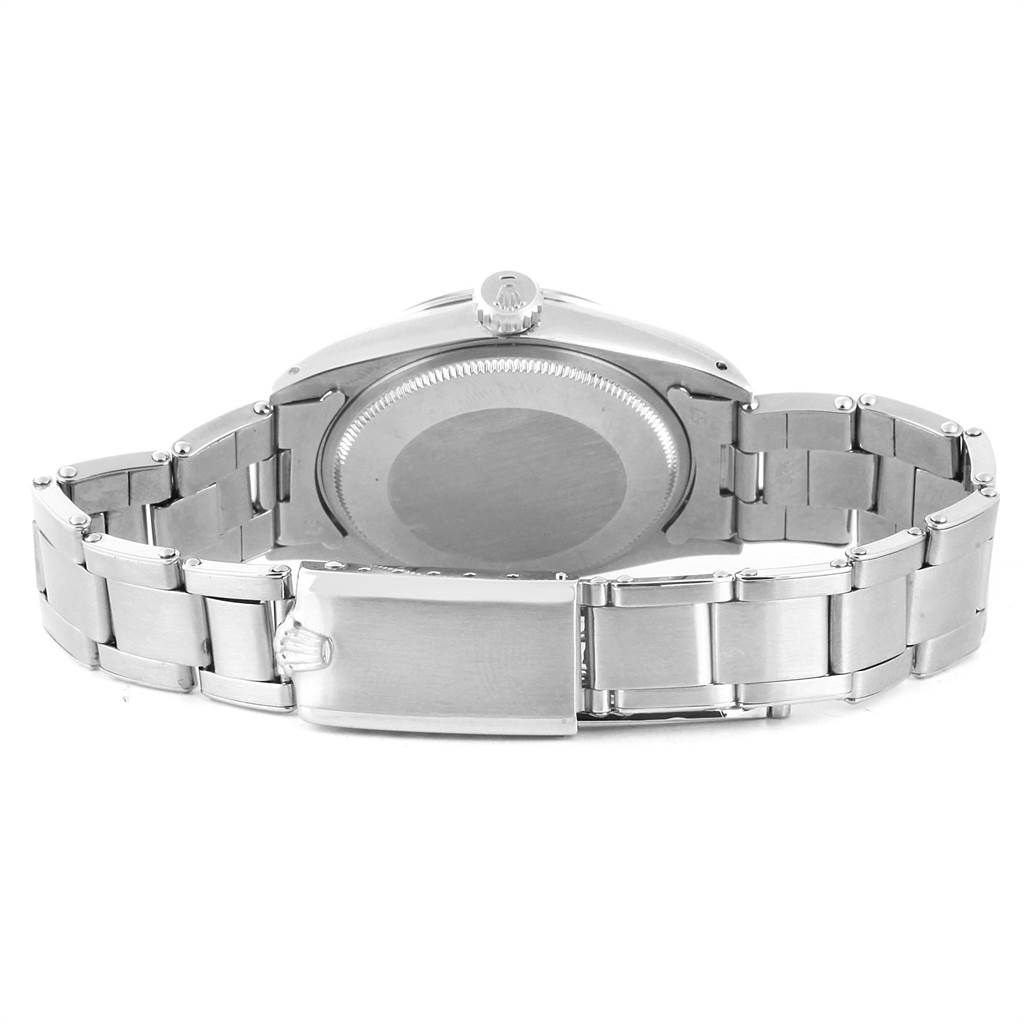 This image shows the back and bracelet of a Vintage Collection Rolex watch from a straight-on angle.