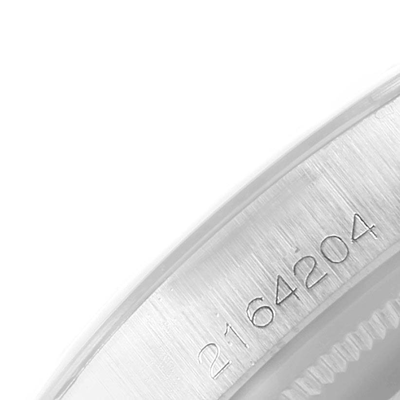 This close-up image shows the engraved serial number on the case of the Rolex Vintage Collection 1500 Men's Stainless Steel Silver Dial 1500 Men's Stainless Steel Silver Dial watch.