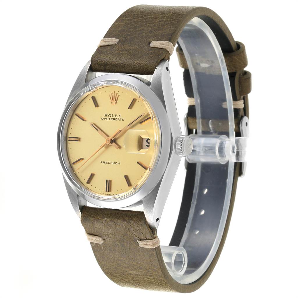 The Vintage Collection Rolex watch is shown at an angled profile highlighting the face, crown, and brown leather strap.