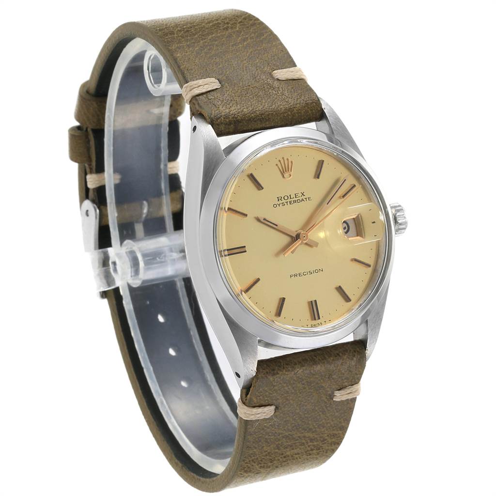 The watch shown is a Rolex Vintage Collection 6694 Men's Stainless Steel Champagne Dial 6694 Men's Stainless Steel Champagne Dial model, displaying the dial, bezel, and leather strap from a front side angle.