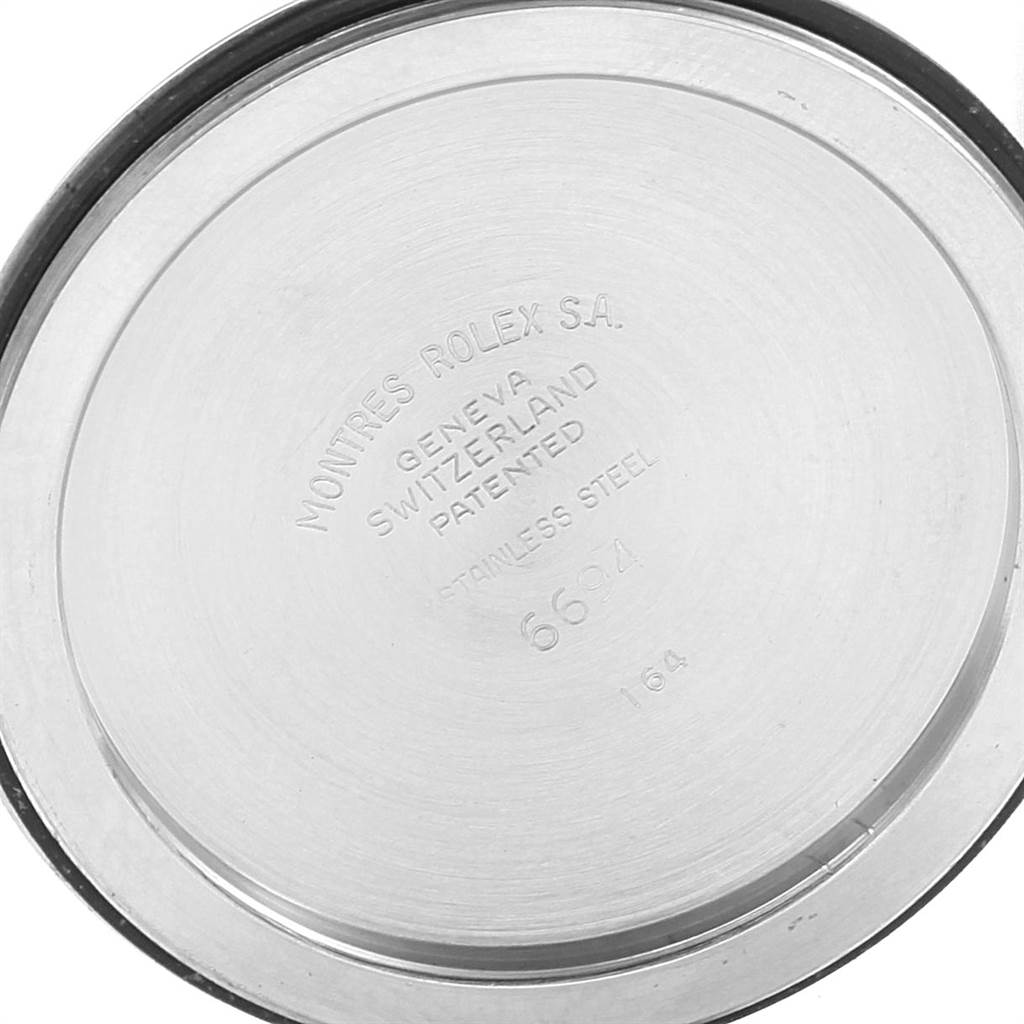 This is the back casing of a Vintage Collection Rolex watch, viewed from a top-down angle.