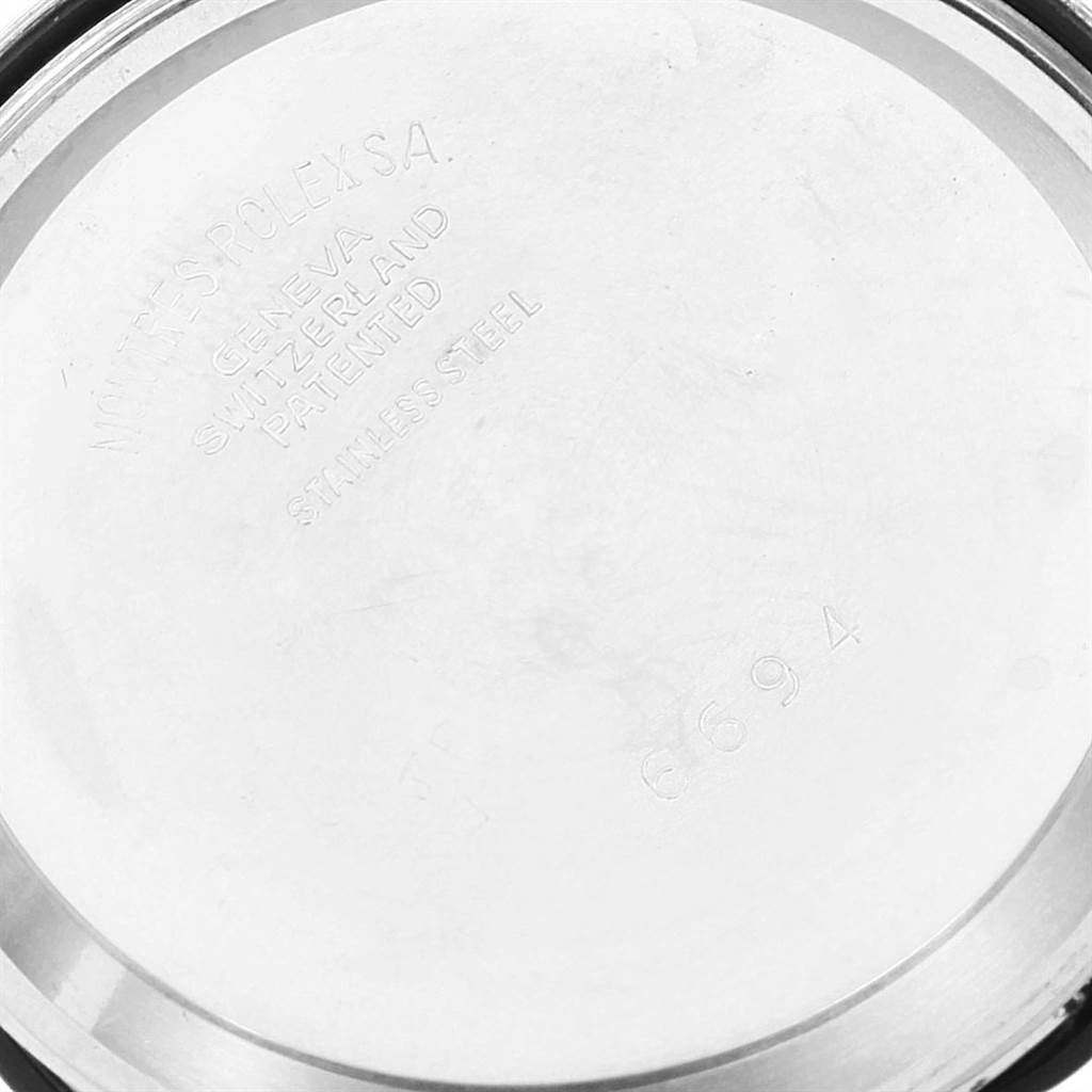 The image shows the back casing of the Rolex Vintage Collection 6694 Men's Stainless Steel Silver Dial 6694 Men's Stainless Steel Silver Dial watch with text indicating its origins and material.