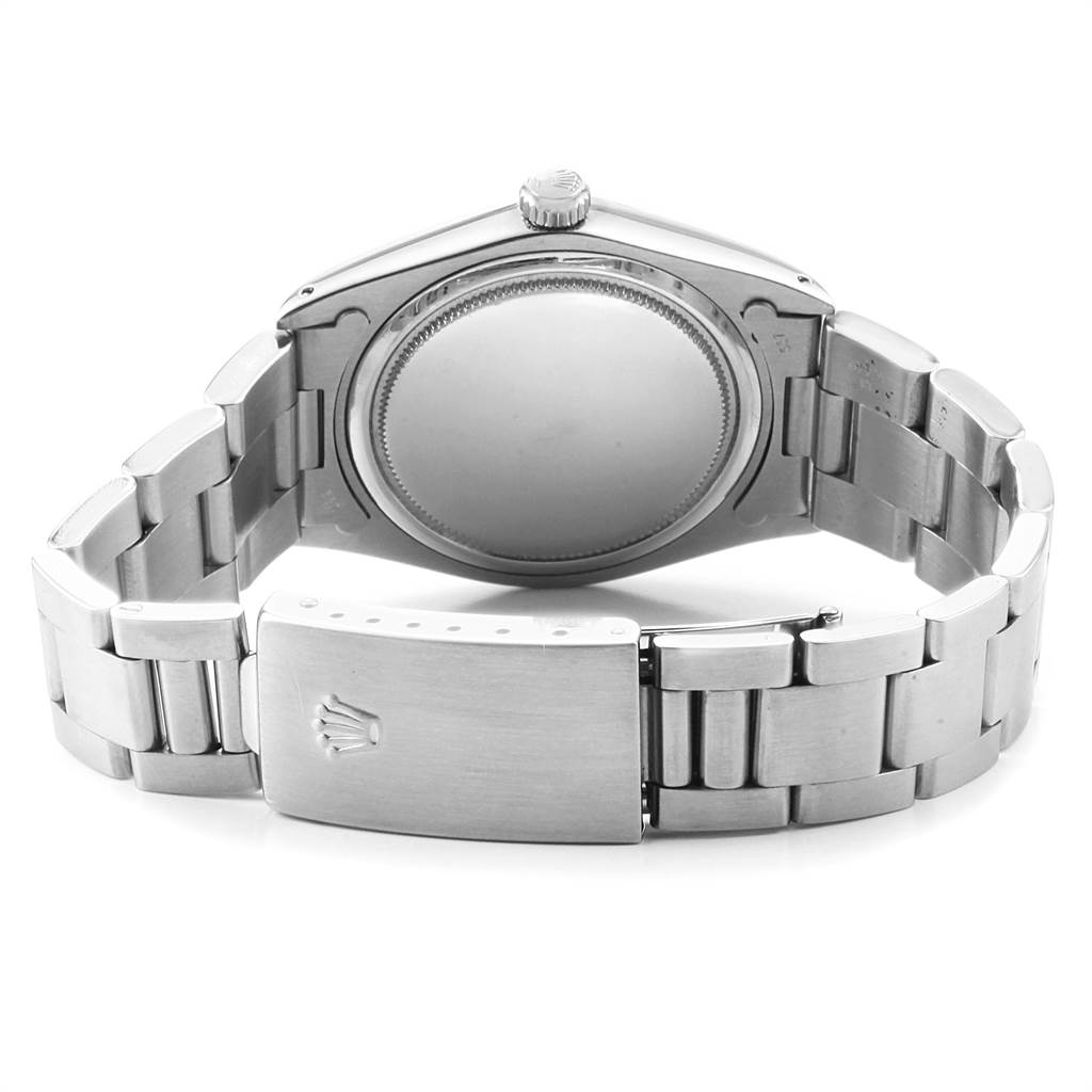 The image shows the back view of a Rolex Vintage Collection 6694 Men's Stainless Steel Silver Dial 6694 Men's Stainless Steel Silver Dial watch case and bracelet.