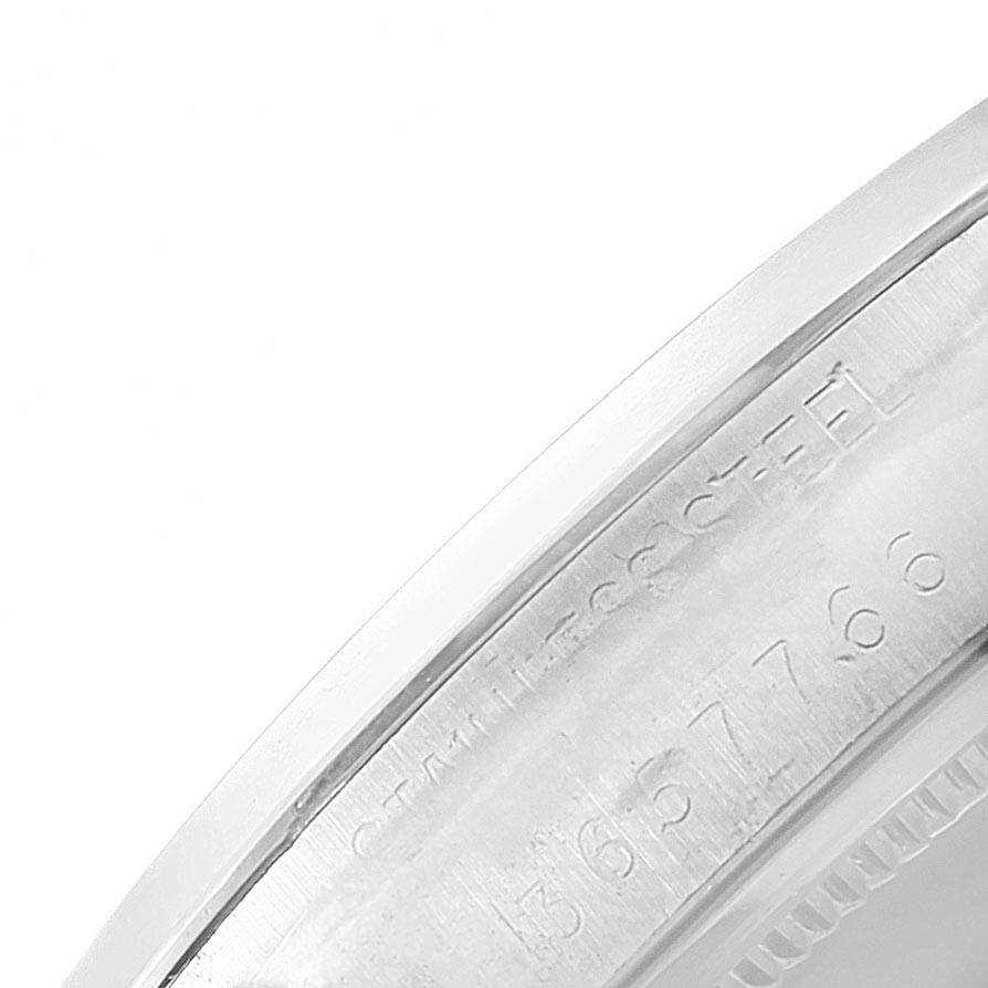 The image shows a close-up of the stainless steel case side with engraved serial numbers on a Rolex Vintage Collection 6694 Men's Stainless Steel Silver Dial 6694 Men's Stainless Steel Silver Dial watch.