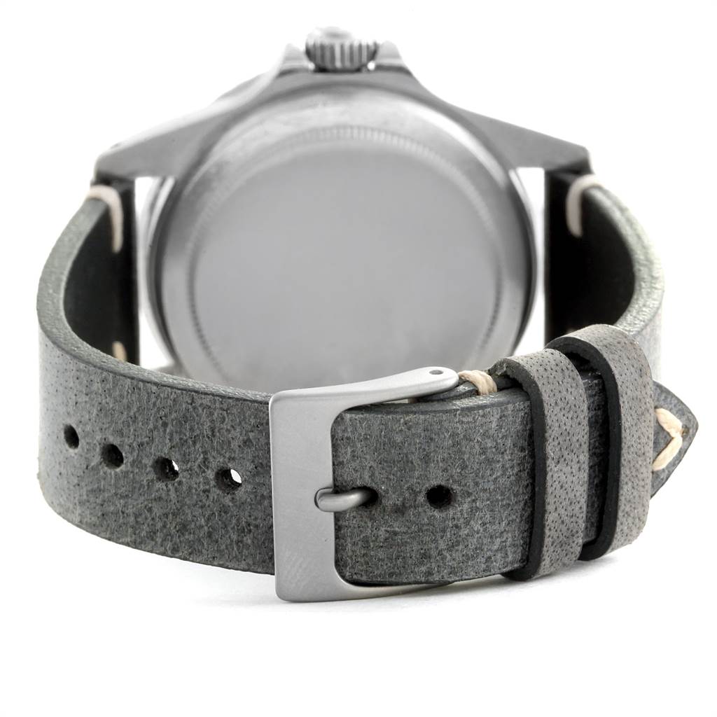 The image shows the back view of a Rolex Vintage Collection 5513 Men's Stainless Steel Black Dial 5513 Men's Stainless Steel Black Dial watch, highlighting the leather strap and buckle.