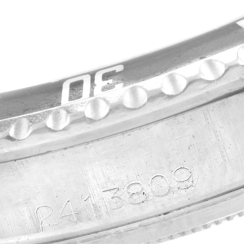 This image shows a close-up of the bezel and serial number engraving on the Vintage Collection model by Rolex.