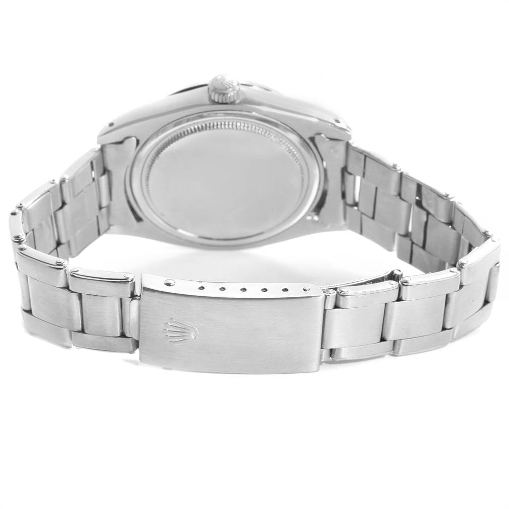 This image shows the back case and bracelet of a Rolex Vintage Collection 6694 Men's Stainless Steel Black Dial 6694 Men's Stainless Steel Black Dial model from a slightly tilted angle.