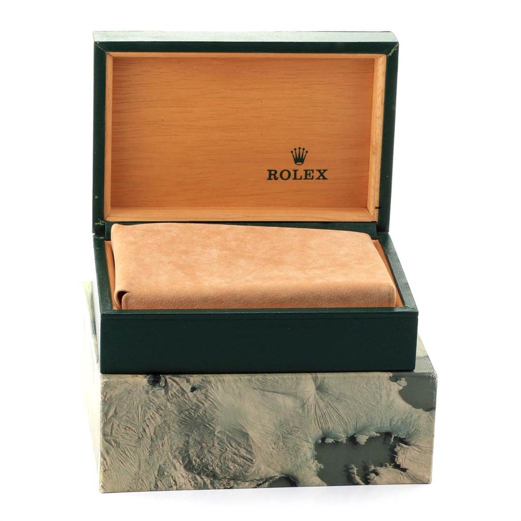 This image shows an open Rolex Vintage Collection 1601 Men's Stainless Steel Silver Dial 1601 Men's Stainless Steel Silver Dial watch box, displaying its interior and cushioning.