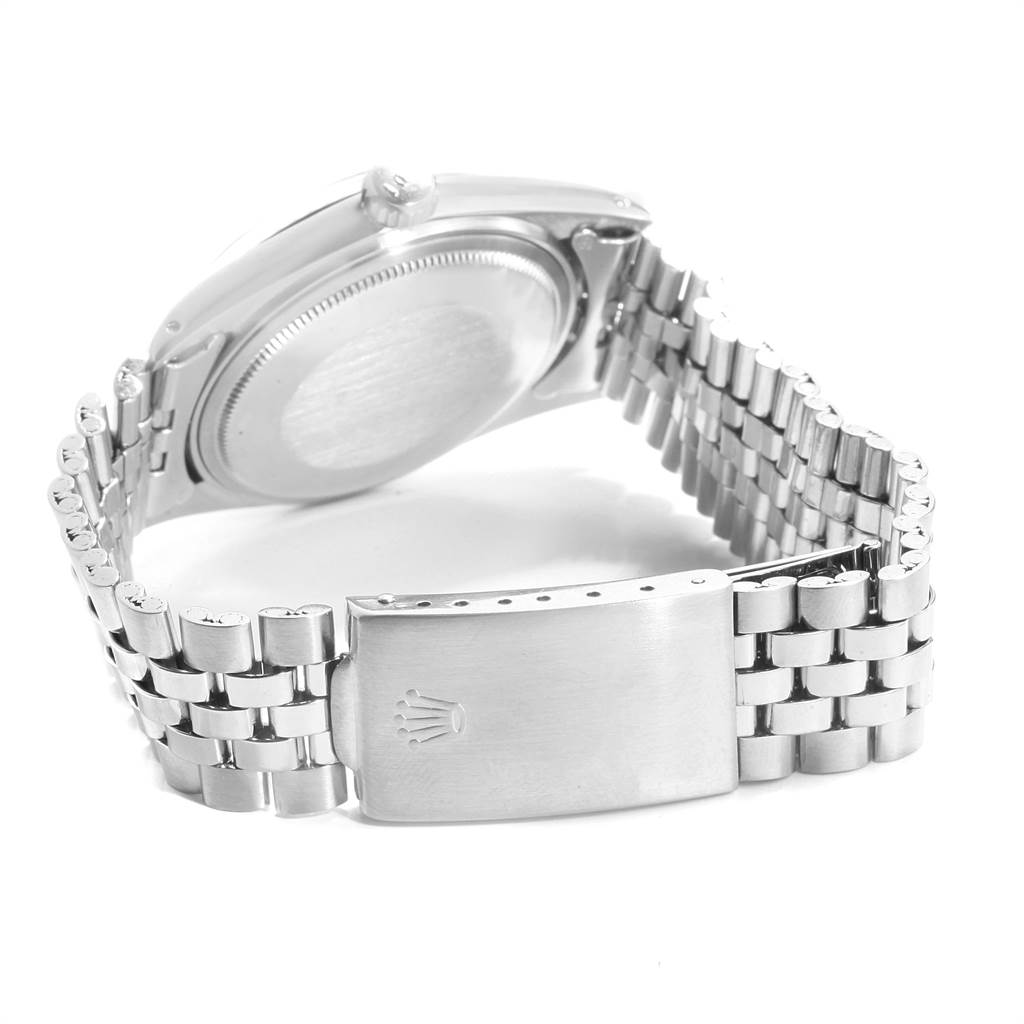 The image shows the back of a Vintage Collection Rolex watch, highlighting its stainless steel bracelet and clasp.