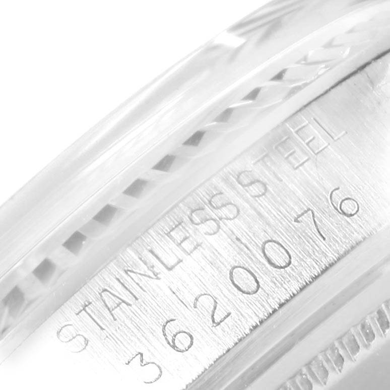 This close-up image shows the stainless steel casing of the Rolex Vintage Collection 1601 Men's Stainless Steel Silver Dial 1601 Men's Stainless Steel Silver Dial watch, focusing on the serial number.