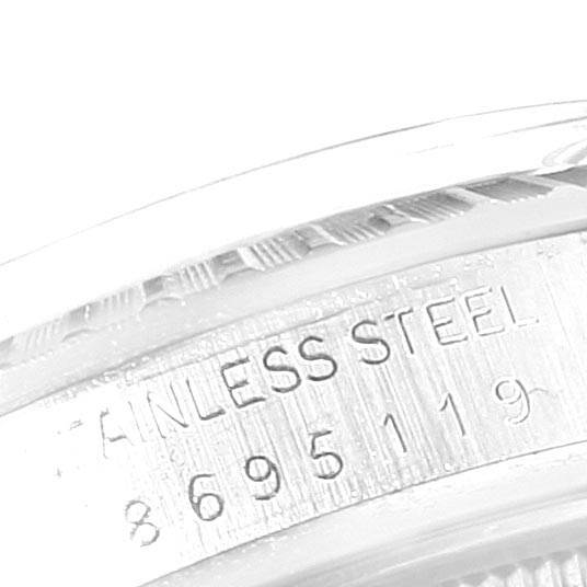 This close-up image shows the stainless steel marking and serial number on the case of a Rolex Vintage Collection 16030 Men's Stainless Steel Silver Dial 16030 Men's Stainless Steel Silver Dial watch.