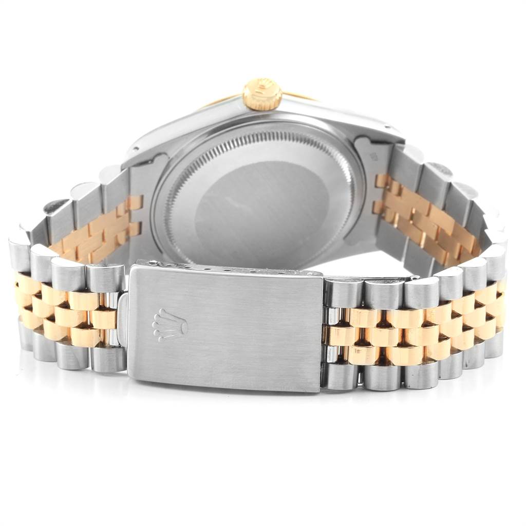 The image shows the back of a Vintage Collection Rolex watch with a two-tone metal bracelet and clasp.