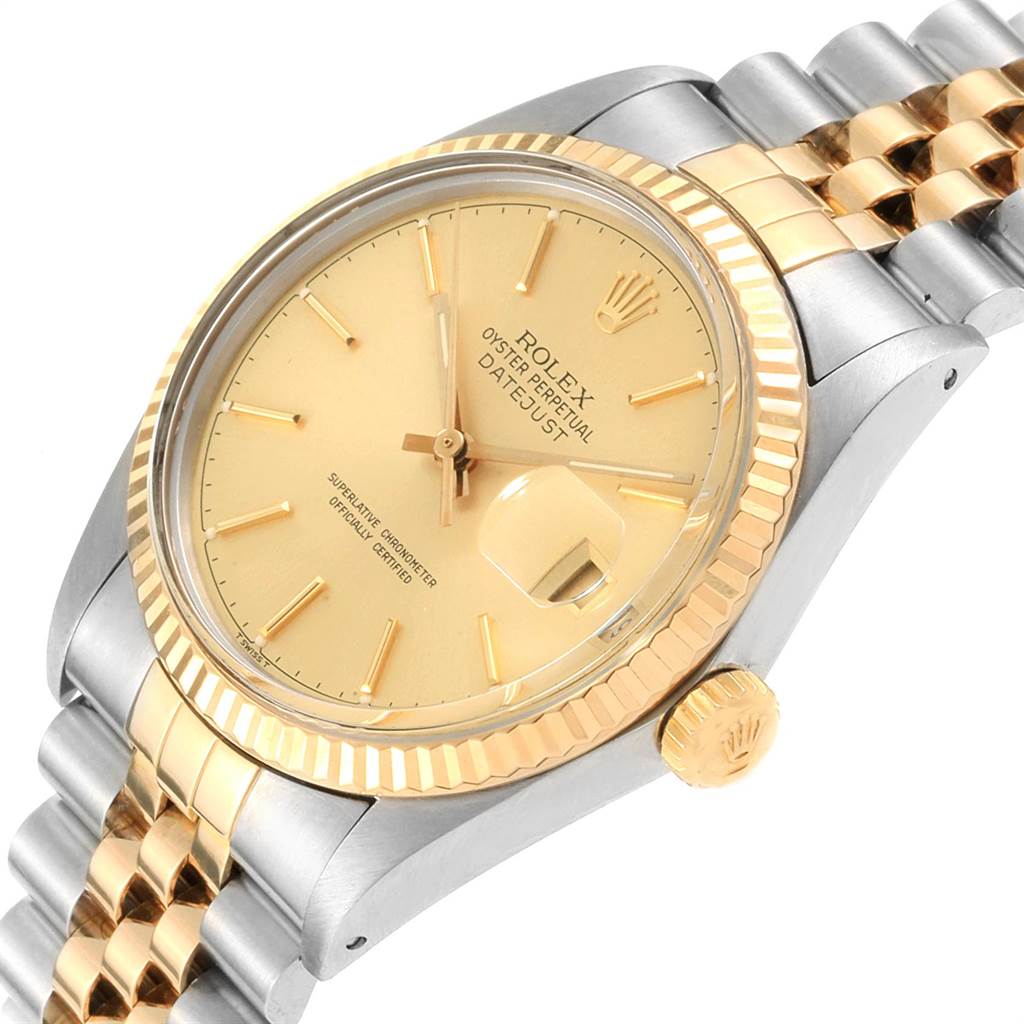 This Rolex Vintage Collection 16013 Men's Stainless Steel Champagne Dial 16013 Men's Stainless Steel Champagne Dial watch is shown at an oblique angle, highlighting its gold face, bezel, crown, and two-tone bracelet.