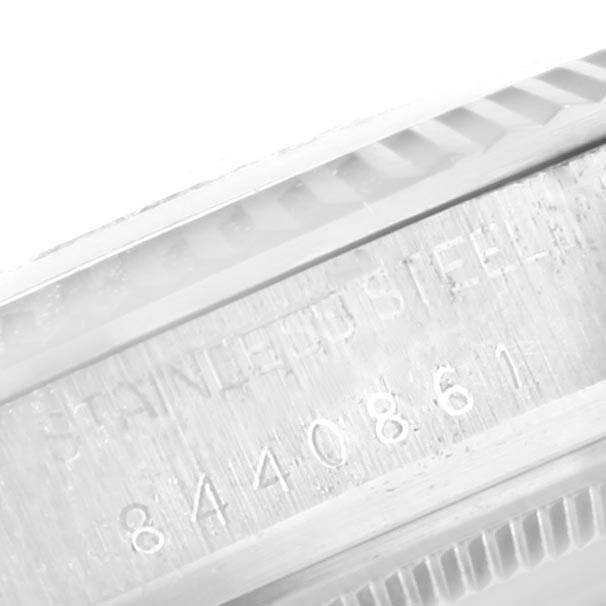 This close-up image shows the serial number engraving on the case side of a Rolex Vintage Collection 16014 Men's Stainless Steel Silver Dial 16014 Men's Stainless Steel Silver Dial model.