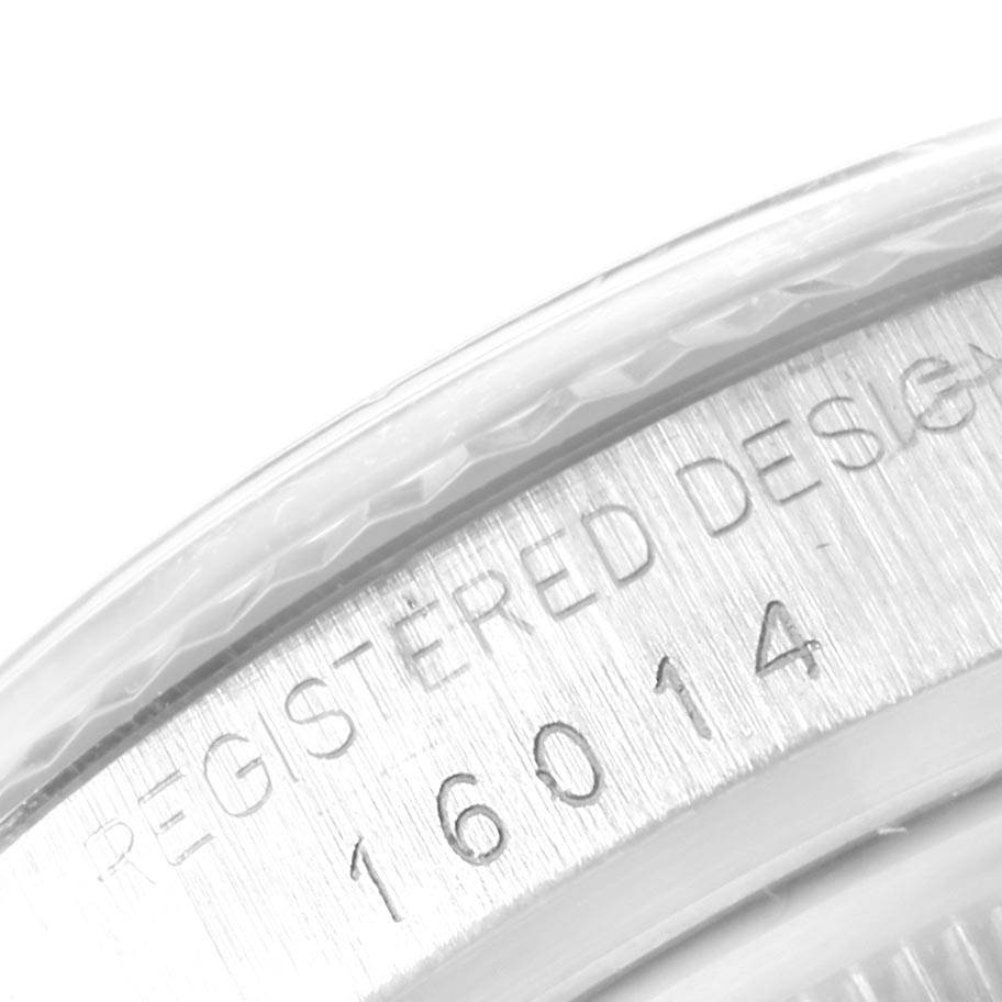 This close-up image of the Rolex Vintage Collection 16014 Men's Stainless Steel Black Dial 16014 Men's Stainless Steel Black Dial model shows the engraved serial number and design details on the watch case.