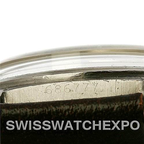 This image shows a close-up view of the side with the serial number and bezel of the Vintage Collection Rolex watch.