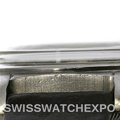 This image shows a close-up of the case back engraving on a Vintage Collection model by Rolex, indicating "STAINLESS STEEL" and the reference number "6050."