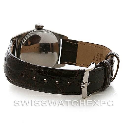 This image shows the back view of a Rolex Vintage Collection 6050 Stainless Steel Silver Dial 6050 Stainless Steel Silver Dial watch, highlighting its leather strap and clasp.