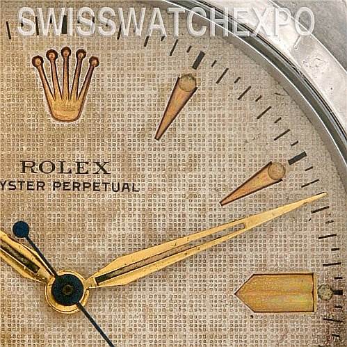 This close-up image shows the dial, hands, and markers of the Vintage Collection Rolex Oyster Perpetual watch.