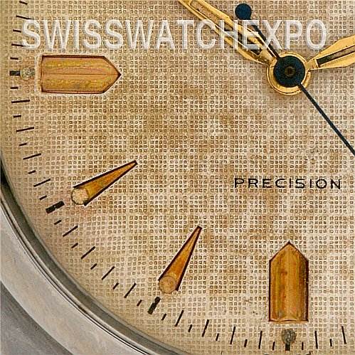 This close-up of the Rolex Vintage Collection 6298 Stainless Steel Beige Dial 6298 Stainless Steel Beige Dial watch shows parts of the dial with hour markers and hands.