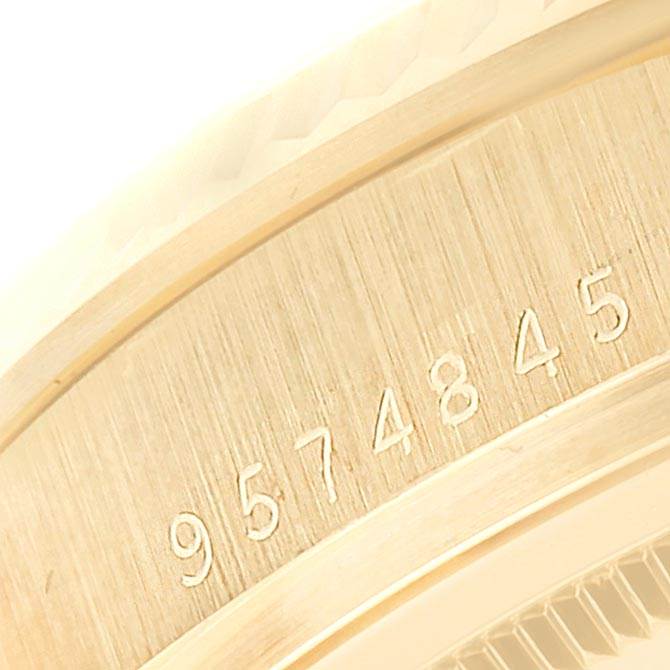 This image shows the serial number engraving on the side of a Vintage Collection Rolex watch case.