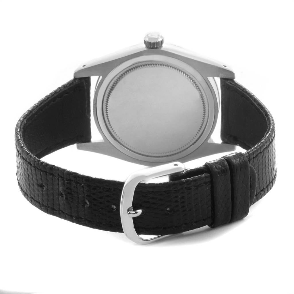 This image of the Vintage Collection model by Rolex shows the back case and leather strap with buckle from a rear angle.